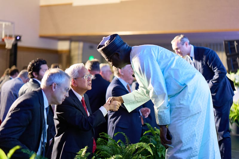 Elder Gerrit W. Gong of the Quorum of the Twelve Apostles, center left, greets guests after speaking about artificial intelligence at the 2026 G20 Interfaith Forum in Salt Lake City on Saturday, Oct. 17, 2026.