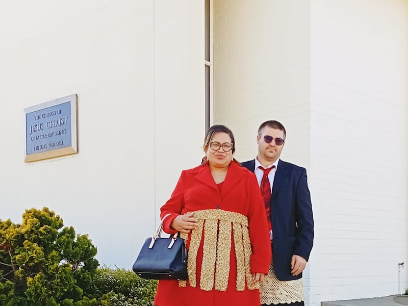 Salome and Shayne Strom pose for a picture wearing Tongan traditional costume with the waist mat or ta’ovala in Wellington, New Zealand, in August 2025.