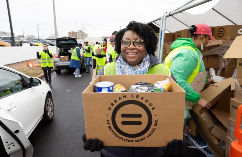 Sister Tracy Y. Browning loads cars at the Martin Luther King Jr. Memorial Tribute food drive in St. Louis, Missouri.