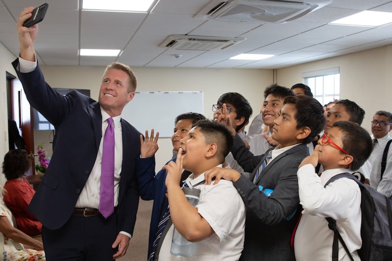 President Timothy L. Farnes, Young Men general president takes a selfie with young men in Oaxaca, Mexico, on Aug. 23, 2025.