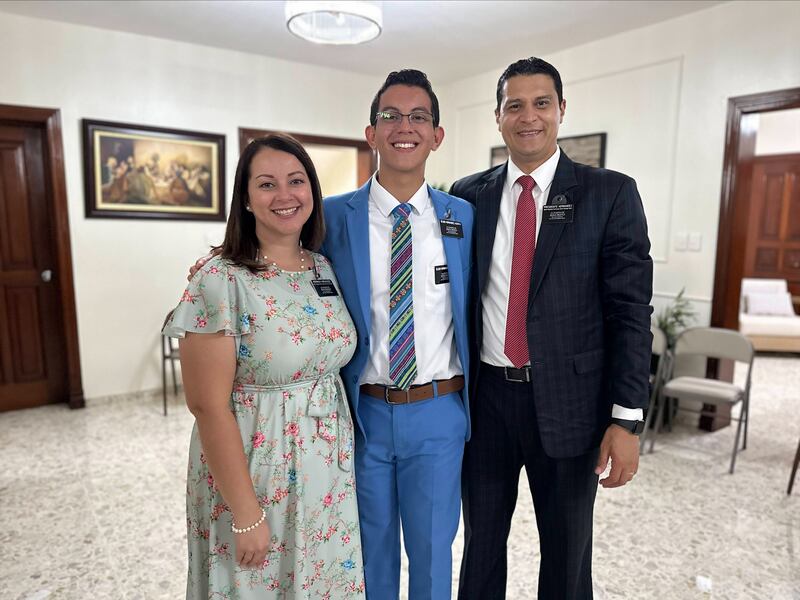 Dominican Republic Santo Domingo West Mission President Hector David Hernandez and Sister Emma Hernandez stand with their son, Elder Oscar David Hernandez, in the Dominican Republic in 2024 before he left for his mission in Nicaragua.