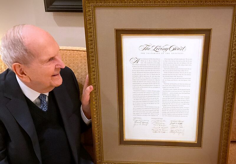 President Russell M. Nelson is pictured with a framed copy of "The Living Christ: The Testimony of the Apostles."