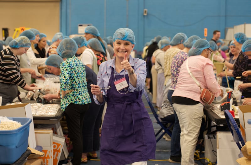 Women package meals for Hunger Fight during the Evening of Service at 2024 BYU Women’s Conference.