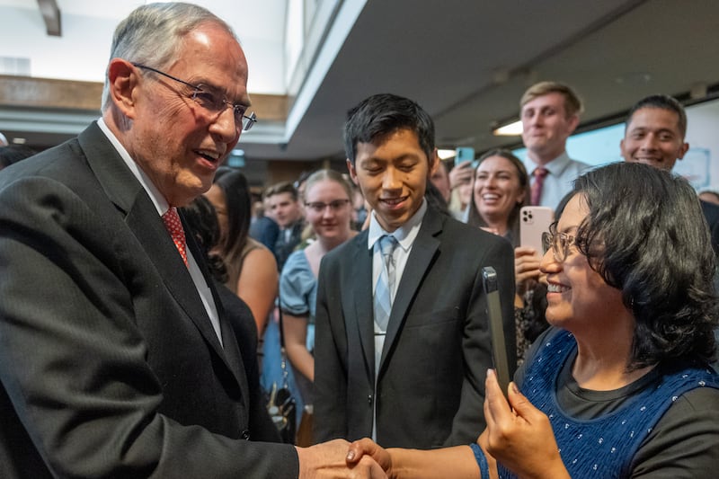 Elder Neil L. Andersen of the Quorum of the Twelve Apostles greets attendees following a young adult devotional in Placentia, California, on Saturday, May 16, 2026.