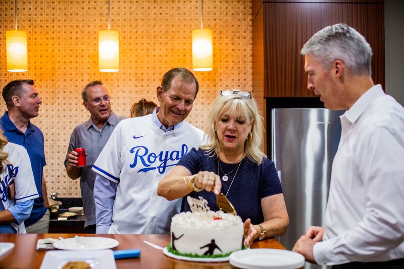 Elder Gary E. Stevenson of the Quorum of the Twelve Apostles receives a surprise birthday cake at a Kansas City Royals baseball game. His wife, Sister Lesa Stevenson, cuts the cake. Elder Stevenson turned 69 on Tuesday, August 6, 2024. His day included throwing the ceremonial first pitch at a Kansas City Royals baseball game. Pictured to the right is Elder Jeremiah Morgan, an Area Seventy.
