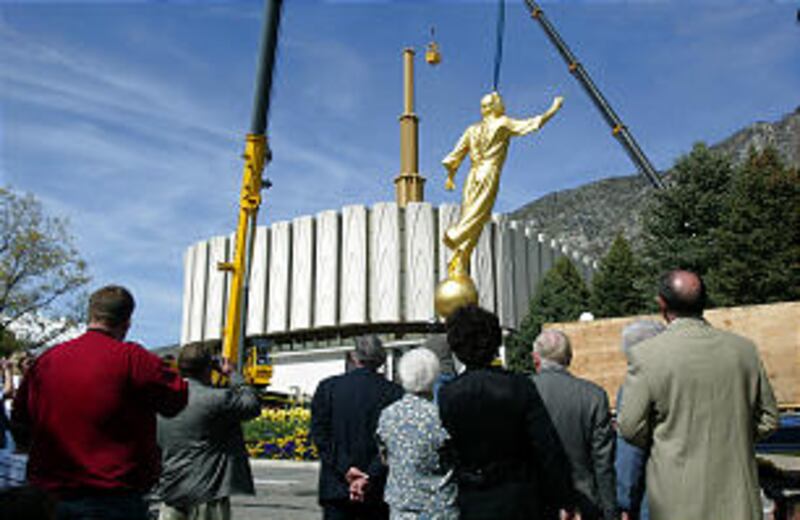 A statue of Angel Moroni is added to the Provo Utah Temple in 2003.